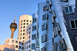 Gehry Buildings, Neuer Zollhof, Rheinturm im background, Media Harbor, Dusseldorf, North Rhine-Westphalia, Germany