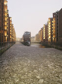 Ice floes on dike, Speicherstadt (storehouse-town), Hamburg, Germany