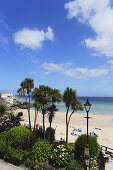 People sunbathing at Porthminster Beach, St. Ives, Cornwall, England, United Kingdom