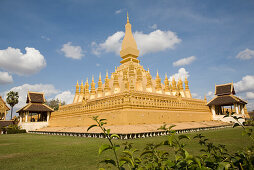 Buddhistic stupa Pha That Luang under blue sky, national symbol and religious monument in Vientiane, capital of Laos