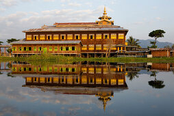 Nga Phe Chaung Kyaung monastary mirrored in the Inle Lake, Shan State, Burma, Myanmar