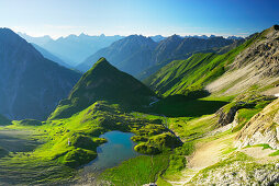 lake unterer Seewisee with hut Memminger Hütte and Seekogel, Allgaeu range in background, Lechtal range, Tyrol, Austria