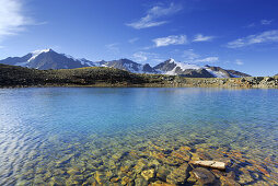 Lake Samoarsee with mounts Mutmalspitze and Similaun, Oetztal range, Tyrol, Austria