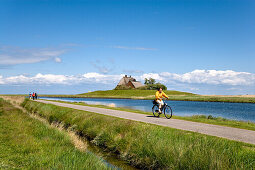 Cyclists, Holm Church, Hallig Hooge, North Frisian Islands, Schleswig-Holstein, Germany