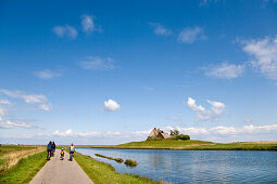 Cyclists, Holm Church, Hallig Hooge, North Frisian Islands, Schleswig-Holstein, Germany