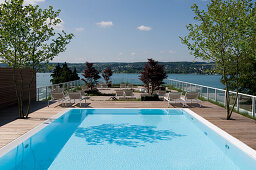 Deserted pool at the roof terrace in the sunlight, Hotel Riva, Constance, Lake Constance, Baden-Wurttemberg, Germany