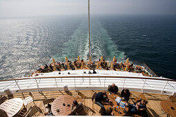 People on the sun deck of cruise ship AidaDiva