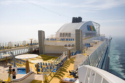 People on the sun deck of cruise ship AidaDiva