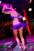 Young woman dancing at Mango's Nightclub, Ocean Drive, South Beach, Miami Beach, Florida, USA