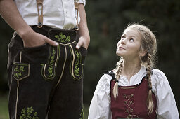 Girl wearing a dirndl, looking up, Kaufbeuren, Bavaria, Germany