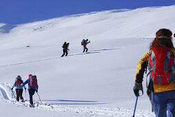 Backcounty skiiers ascending Wiedersberger Horn, Kitzbuehel Alps, Tyrol, Austria