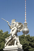 Sculptures of castle bridge, television tower in background, Berlin, Germany