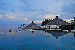 The infinity pool at the Amankila Resort in the evening, Candi Dasa, Eastern Bali, Indonesia, Asia