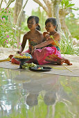 Girl with floral wreaths at the lobby of Four Seasons Resort, Jimbaran, Bali, Indonesia, Asia