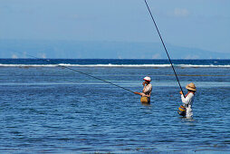 Fishermen angling in the lagoon, Nusa Dua, Bali, Indonesia, Asia