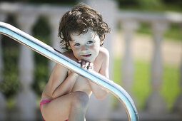 4 years old girl in swimming-pool.