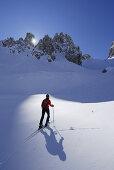 Woman backcountry skiing, Cadini range, Dolomites, Trentino-Alto Adige/Südtirol, Italy