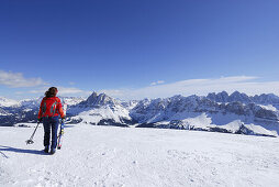 Backcountry skier carrying skies, Grosser Gabler, Valle Isarco, Dolomites, Trentino-Alto Adige/Südtirol, Italy