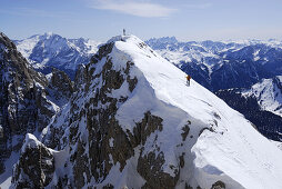 Backcountry skier ascending summit, Plattkofel, Langkofel range, Dolomites, Trentino-Alto Adige/Südtirol, Italy