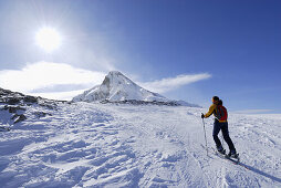 Woman backcountry skiing ascending Zischgeles, Sellrain, Stubai range, Tyrol, Austria