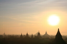 Temple towers at the plain of Bagan at sunrise, Bagan, Myanmar, Burma, Asia