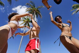 Young people dancing salsa at beach, Playas del Este, Havana, Ciudad de La Habana, Cuba, West Indies