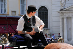 Cabby sitting on Fiaker, Spanish Riding School, Hofburg Imperial Palace, Vienna, Austria