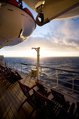 Promenade deck with deck chairs at sunset, Cruise liner Queen Mary 2, Transatlantic, Atlantic ocean