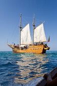 Sailing boat Santa Bernada, now taking tourists along the steep coast of the Algarve, Portimao, Algarve, Portugal