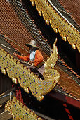 Workers replacing roof tiles, Wat Chedi Luang, Chiang Mai, Thailand, Asia