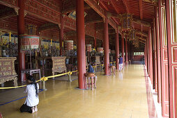 Praying woman at a temple, forbidden Purple City in the imperial town of Hue, Thua Thien-Hue Province, Vietnam, Asia