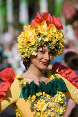 Young woman in a floral costume at the Madeira Flower Festival, Funchal, Madeira, Portugal