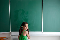 Schoolgirl near blackboard, Hambug, Germany