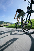 Persons mountain biking near Tre Cime di Lavaredo, Veneto, Italy