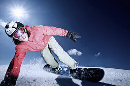 Snowboarder on slope, Kappl, Tyrol, Austria