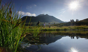 Family hiking along mountain lake, Dellach, Carnic Alps, Carinthia, Austria