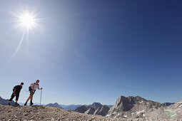 Two hikers on Zugspitzplatt, Wetterstein range, Bavaria, Germany