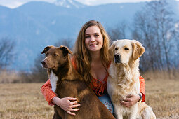 Young woman with dogs, Upper Bavaria, Germany, Europe