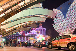 Taxis in front of the illuminated Casino Hotel Grand Lisboa at night, Macao, China, Asia