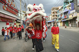 Teenagers at dragon dance during Tet festival at a suburb, Saigon, Ho Chi Minh City, Vietnam, Asia
