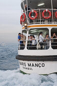 passengers on commuter ferry Golden Horn, Istanbul, Turkey