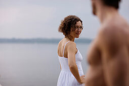 Mid adult woman flirting with a man, Starnberger See, Upper Bavaria, Germany
