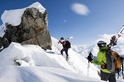 Skiers ascending mount La Muota, Surselva, Grisons, Switzerland