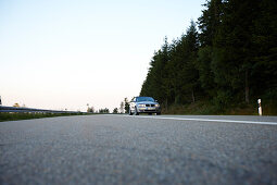 Cabrio passing Black Forest High Street in the morning, Black Forest, Baden-Wuerttemberg, Germany