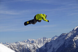Snowboarder jumping, Crap Sogn Gion, Laax, Grisons, Switzerland