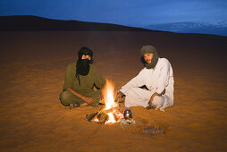 tuaregs preparing tea at campfire, Libya, Africa