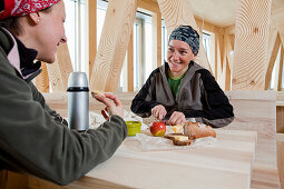 Two women having a snack, New Monte Rosa Hut, Zermatt, Canton of Valais, Switzerland