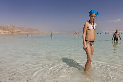 Young girl standing in the Dead Sea, En Bokek, Israel, Middle East