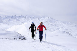 Two women backcountry skiing, Niederjoch, Langer Grund, Kitzbuehel range, Tyrol, Austria, Europe