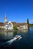 Boat on the lake and St. Georgen monastery in the sunlight, Stein am Rhein, High Rhine, Lake Constance, Canton Schaffhausen, Switzerland, Europe